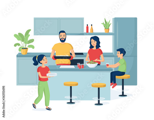 Happy family with kids preparing dinner in the kitchen. Father, mother, daughter and son are laughing. Children help parents prepare tasty and healthy food. Happy, sincere and warm atmosphere at home.