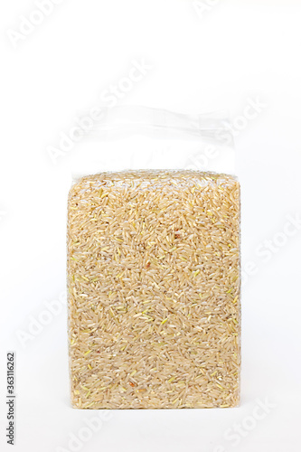 Brown rice in vacuum package isolated on white background.