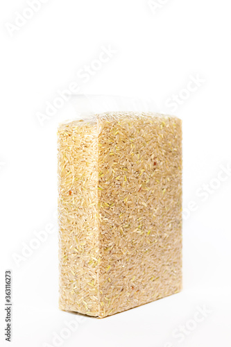 Brown rice in vacuum package isolated on white background.