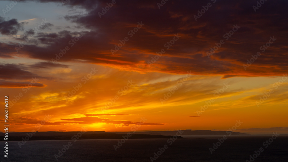 The sunsets over the sea near Thornwick Bay, Flamborough Head, East Yorkshire, UK