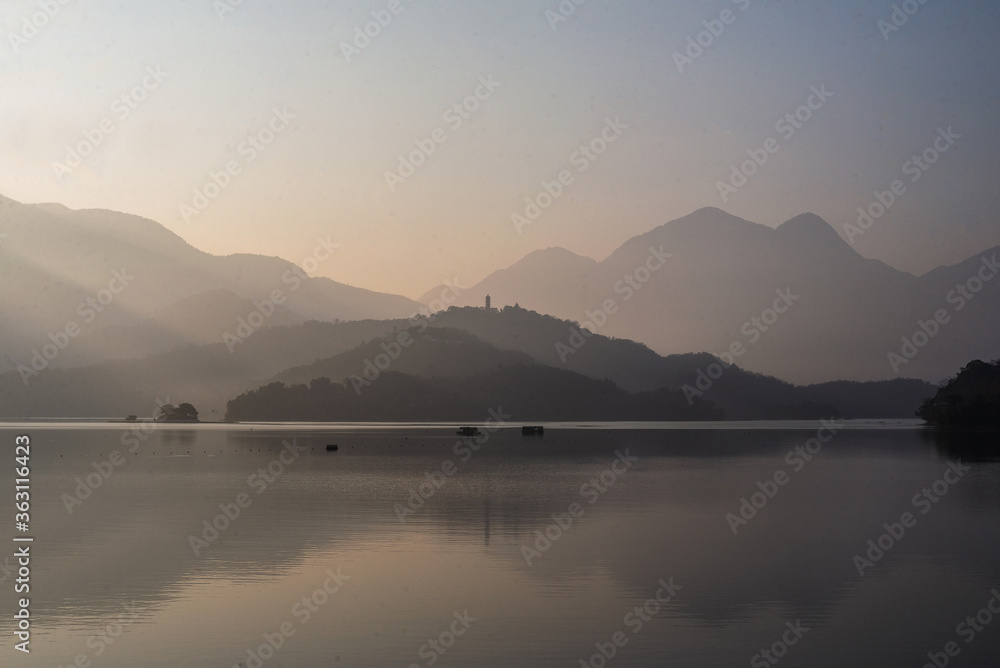 morning light shining in  peaceful mountain in the lake