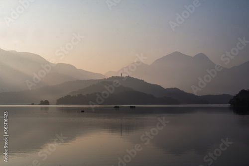 morning light shining in peaceful mountain in the lake