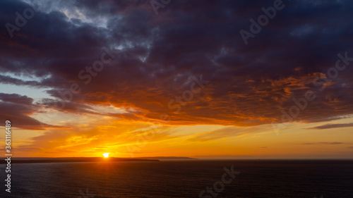 The sunsets over the sea near Thornwick Bay, Flamborough Head, East Yorkshire, UK