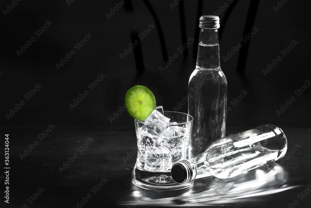 sparkling water in glass on black background sparkling water in glass on black background