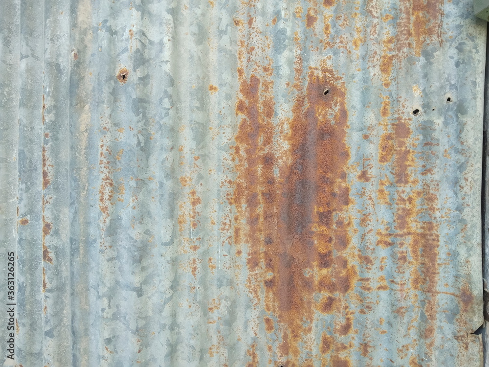 Old zinc plate wall covered with red rust texture background.