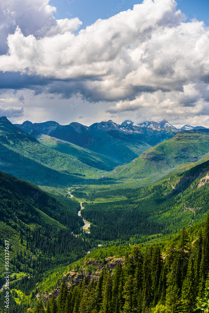 The mountains and valleys in Glacier National Park, Montana, on a cloudy day.