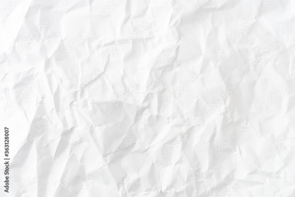 Obraz premium Top view of white crumpled paper background.