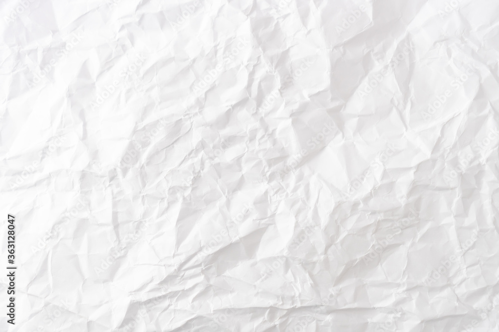 Fototapeta premium Top view of white crumpled paper background.