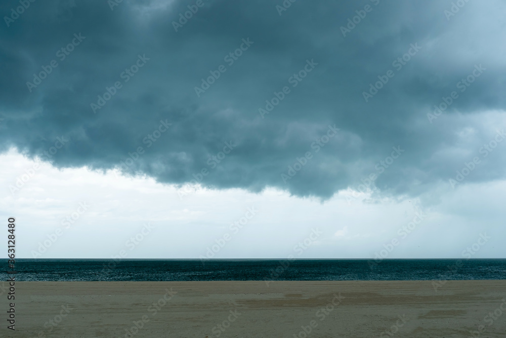Dark huge cloud sky black stormy cloud motion in big rain day and beach.