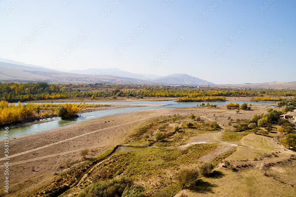 Autumn landscapes with fantastic views from mountain to valley and blue river. Colourful mountain nature in autumn, summer, or spring day Autumn landscapes with fantastic views from mountain to valley and blue river. Colourful mountain nature in autumn, summer, or spring day