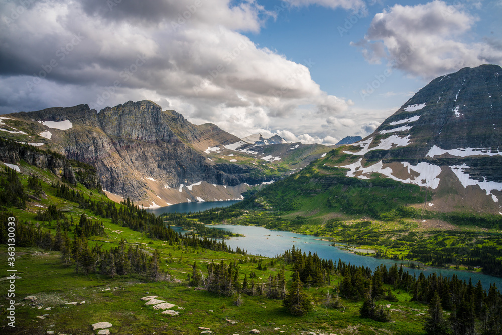 The hidden lake and mountains in Glacier National Park, in Montana, on a cloudy day.