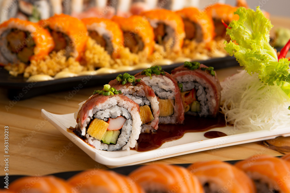 Wagyu beef roll norimki on assort of another maki roll Wagyu beef roll norimki on assort of another maki roll