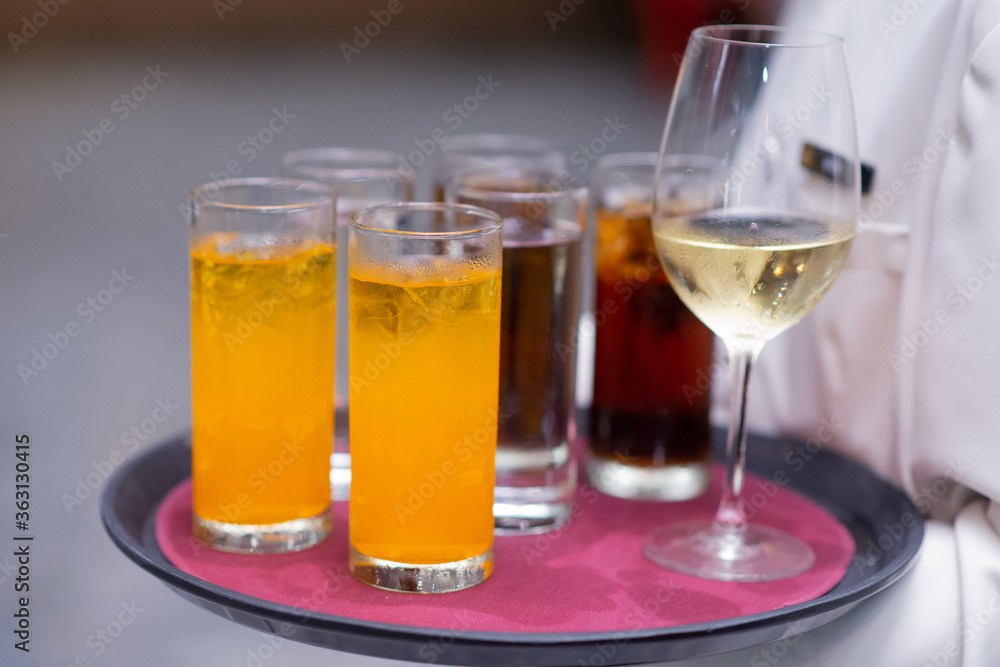 waitress are holding beverage tray for party guest waitress are holding beverage tray for party guest