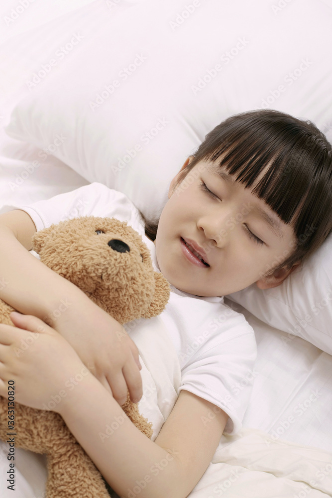 Girl sleeping and hugging soft toy Girl sleeping and hugging soft toy