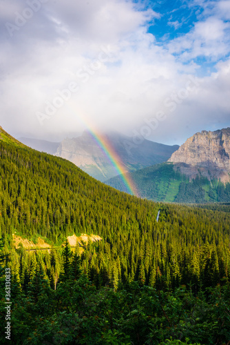 A rainbow in the mountains of Glacier national park, Montana.