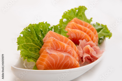 Sliced salmon sashimi on ice