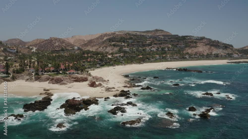 Aerial view of Cabo San Lucas. Slow push in on resort coastline. Beautiful sunny day. Aerial view of Cabo San Lucas. Slow push in on resort coastline. Beautiful sunny day.