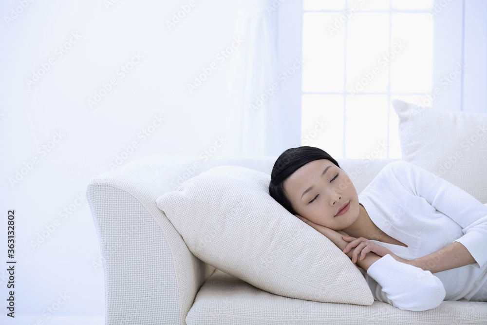 Woman taking a nap on the couch Woman taking a nap on the couch