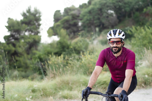 Close-up of a cyclist man in a forest © gonzagon