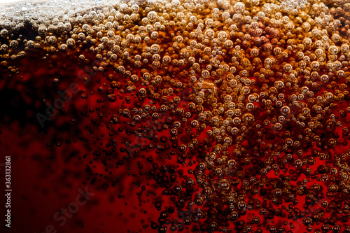 Close up bubble of cola soda on glass cold drink beverage background
