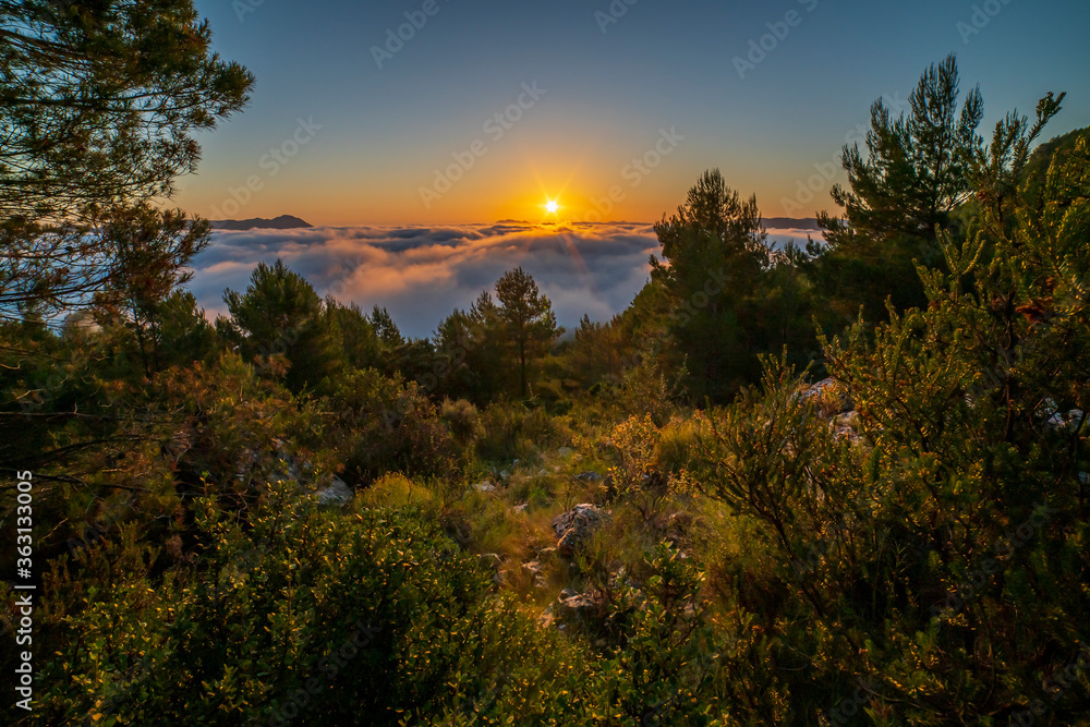 Sunrise views from the Montcabrer mountain in a day with clouds, Cocentaina. Sunrise views from the Montcabrer mountain in a day with clouds, Cocentaina.