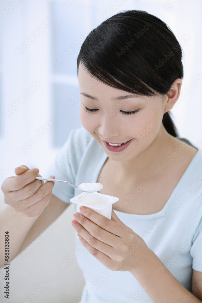 Woman eating yoghurt