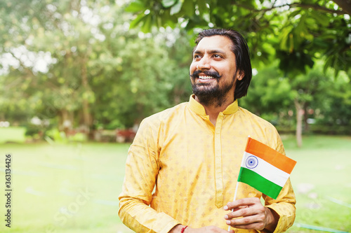 Indian patriot with national flag on Independence day of India