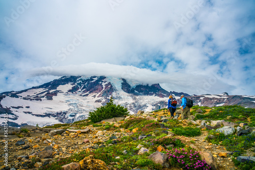 Fototapeta Naklejka Na Ścianę i Meble -  A cloud covered over the snow cap on Mount Rainier, in Washington.