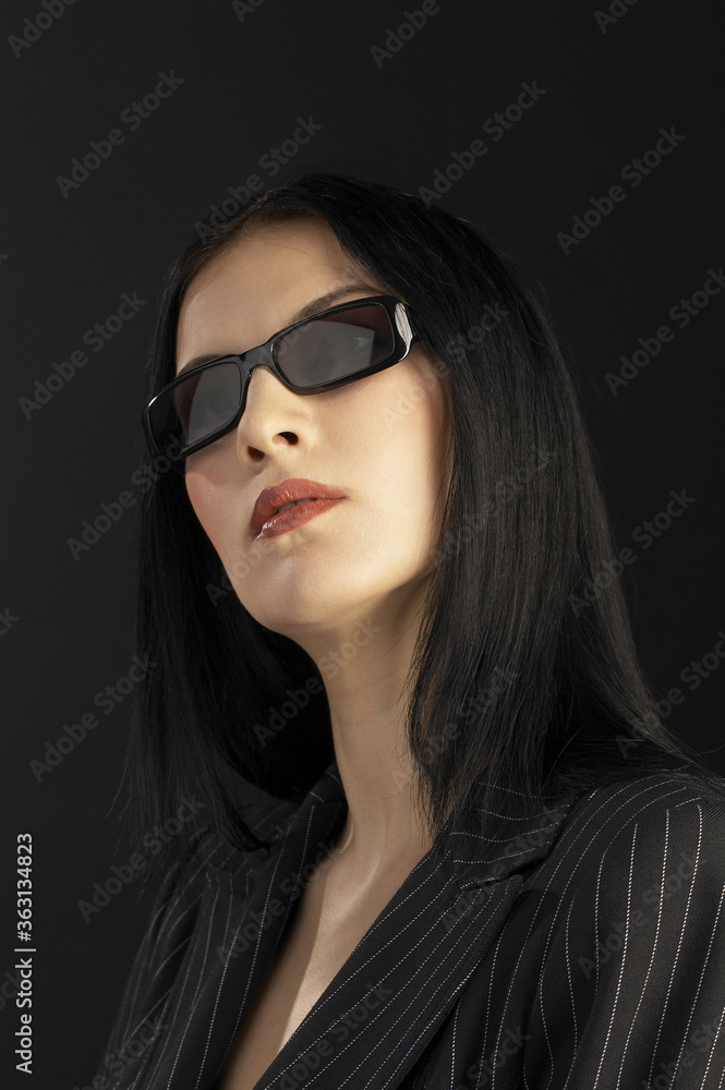 Close-up of a lady in office attire wearing a sunglass