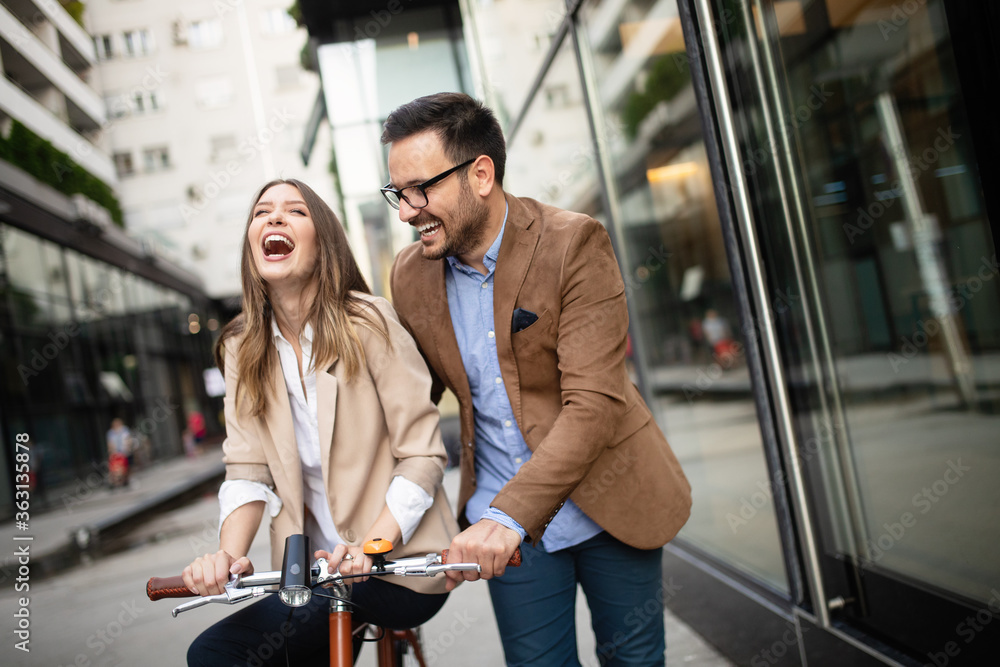 Office woman with business man couple enjoying break while talking flirting outdoor Office woman with business man couple enjoying break while talking flirting outdoor