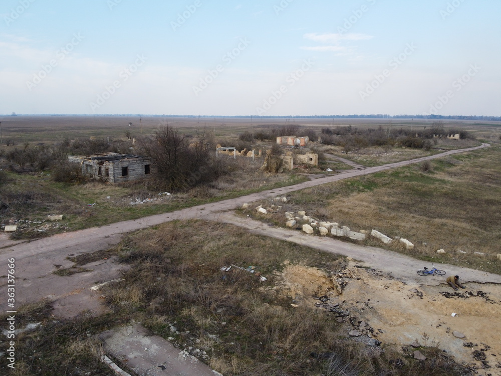 Destroyed livestock farm in the north of Ukraine, aerial view. Dilapidated industrial buildings.