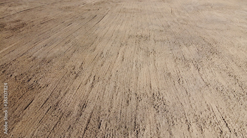 Plowed agricultural field, aerial view. Agricultural land. Background.