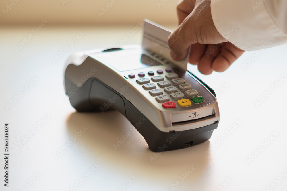 Customers pay for goods at the counter via EDC.