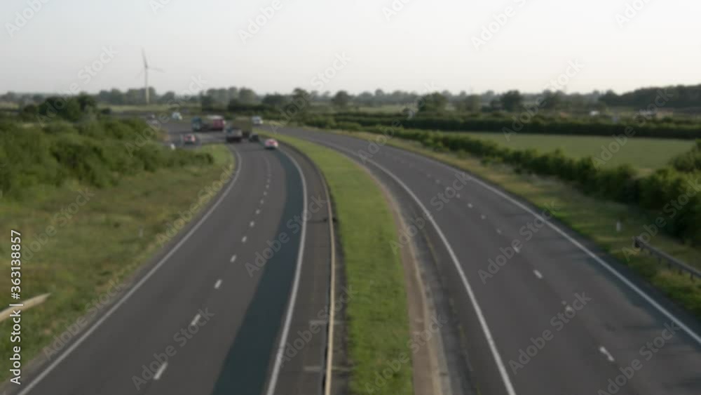 Out of focus background of highway traffic at sunrise. Lincolnshire England Out of focus background of highway traffic at sunrise. Lincolnshire England