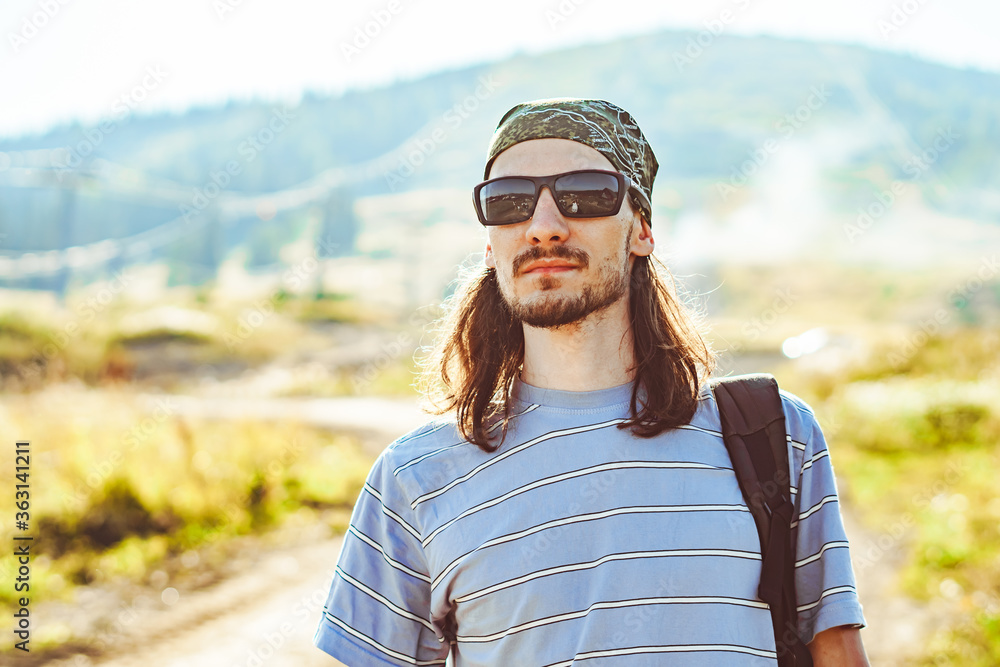 a guy with glasses looks at the sun a guy with glasses looks at the sun