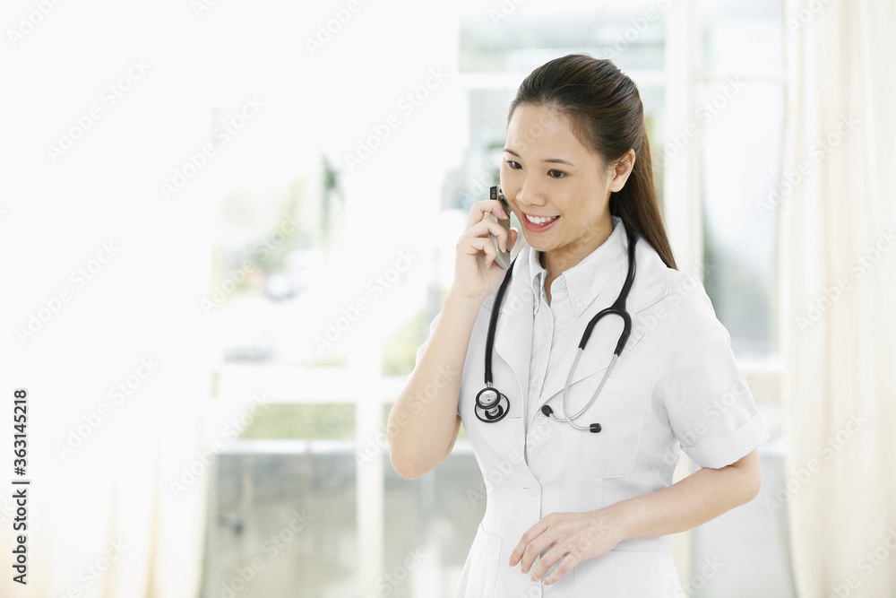 Female doctor talking on the phone