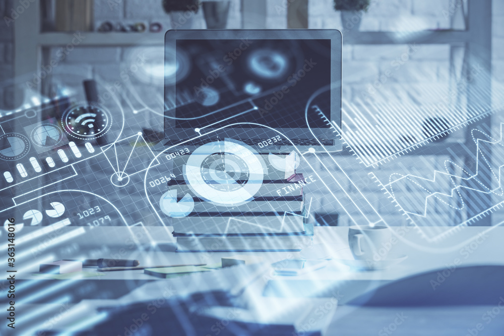 Computer on desktop in office with technology theme hologram. Double exposure. Tech concept. Computer on desktop in office with technology theme hologram. Double exposure. Tech concept.