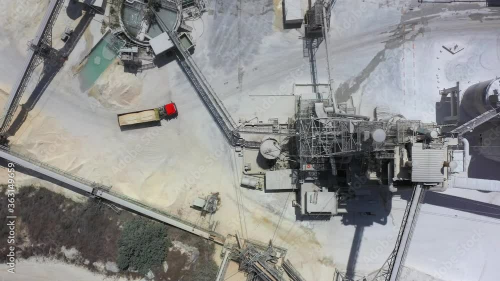 Aerial view of a large Quarry during work hours with Stone sorting conveyor belts and an open pit mine. Aerial view of a large Quarry during work hours with Stone sorting conveyor belts and an open pit mine.