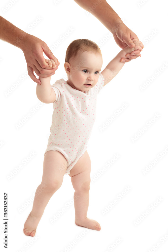 Smiling child walking hand in hand with father Smiling child walking hand in hand with father