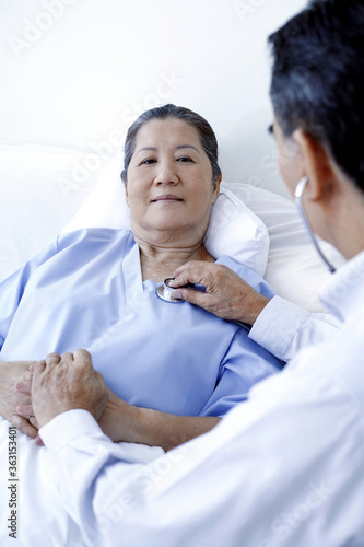 Doctor and patient in ward