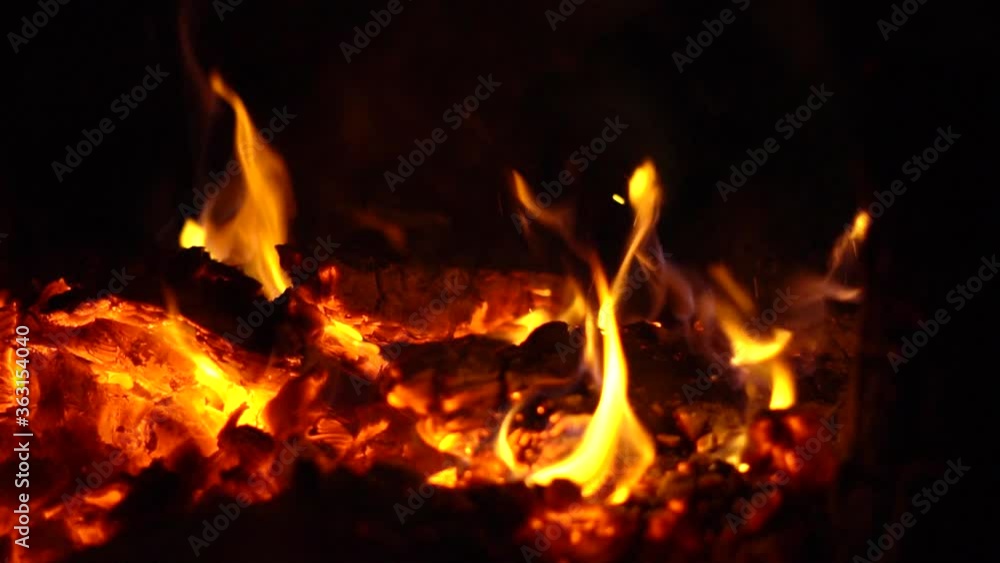 a fire is burning at night sparks fly a fire is burning at night sparks fly
