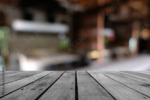 old wooden table and kitchen blur