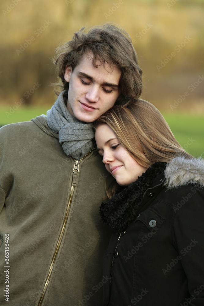 Fototapeta premium Happy couple leaning on each other