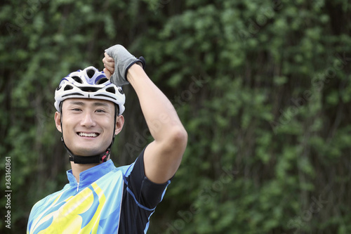 Male cyclist jubilating photo