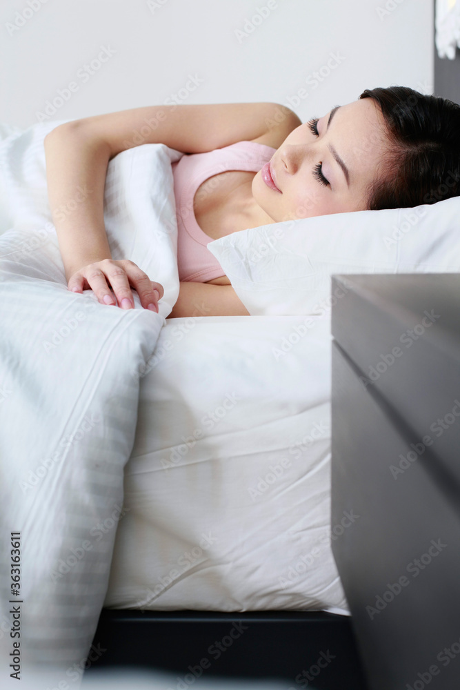 Woman sleeping in bed