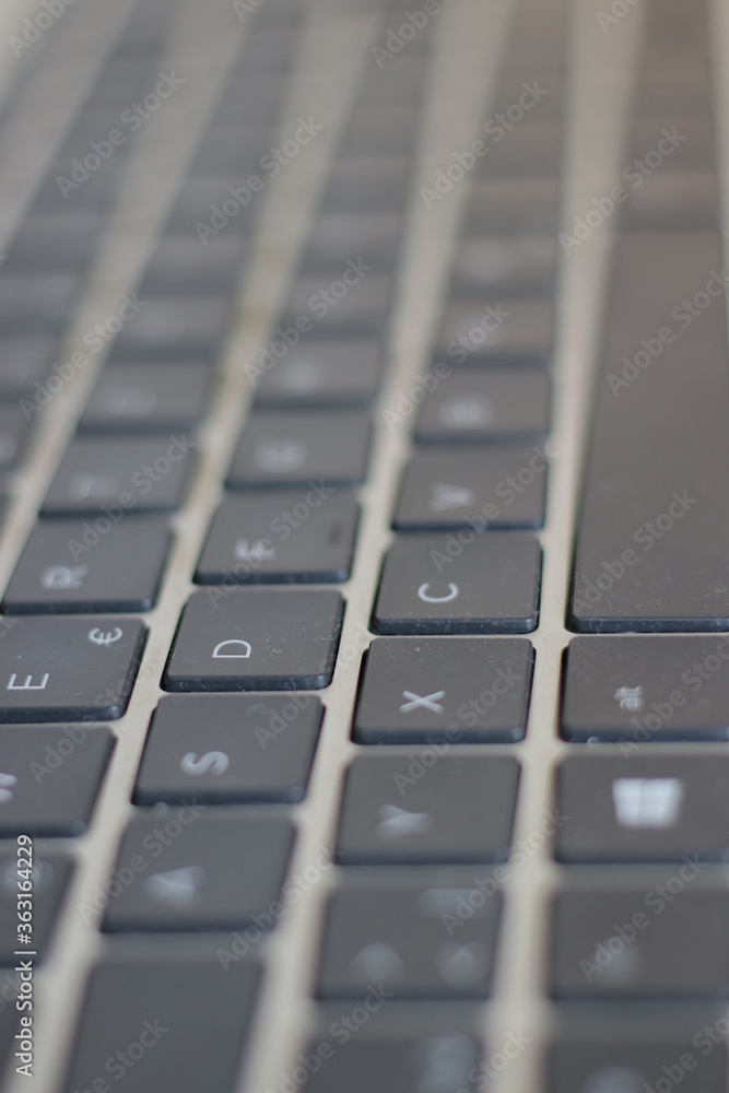 close up of a laptop keyboard with bokeh close up of a laptop keyboard with bokeh