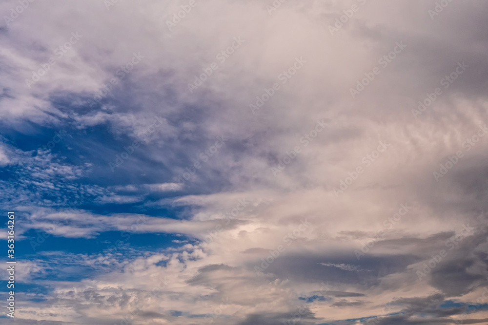 Fototapeta premium White fluffy clouds on clear blue sky. Nature background.