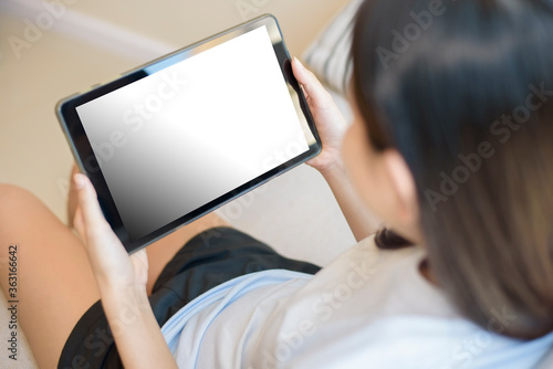 Tablet monitor view mockup over girl shoulders at home