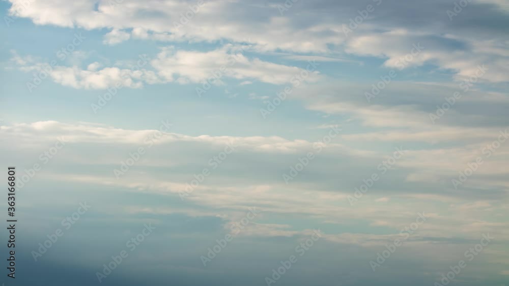 Fluffy white clouds moving fast in time-lapse. Sunny weather, cloudy heaven background. Timelapse of beautiful clouds in blue sky before rain storm, perfect background for your title text or logo Fluffy white clouds moving fast in time-lapse. Sunny weather, cloudy heaven background. Timelapse of beautiful clouds in blue sky before rain storm, perfect background for your title text or logo