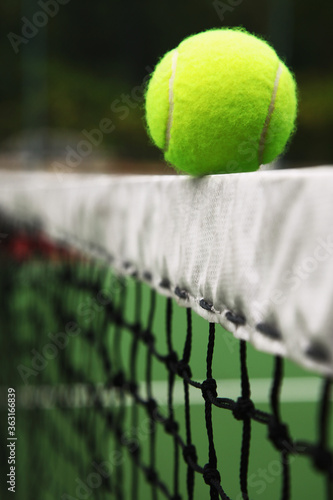 Tennis ball on tennis net © ImageHit